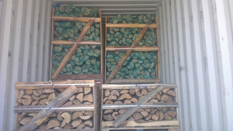 mixed load firewood hardwood on pallet boxes and net bags on pallet boxes